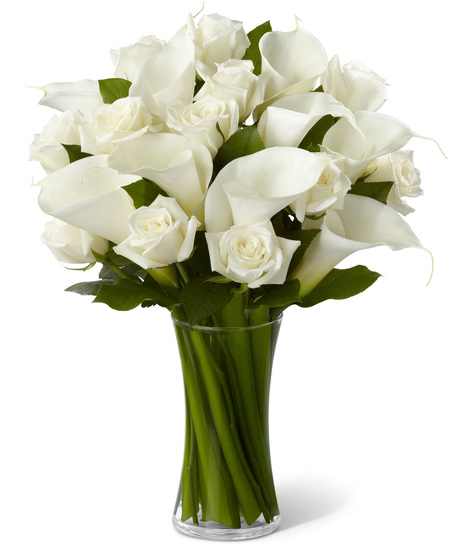 White Roses and White Calla Lilies in a Glass Vase