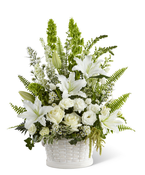 White sympathy flowers in a basket