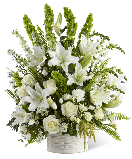 White sympathy flowers in a basket
