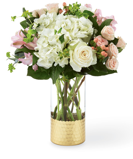 Hydrangea and rose bouquet in a designer glass vase