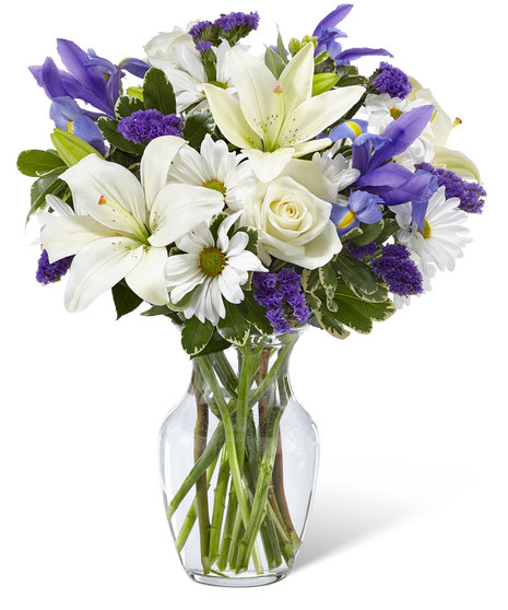 White and Purple Flowers in a Glass Vase