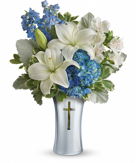 White and Blue Flowers in a Sympathy Vase With Cross