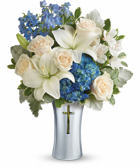 White and Blue Flowers in a Sympathy Vase With Cross