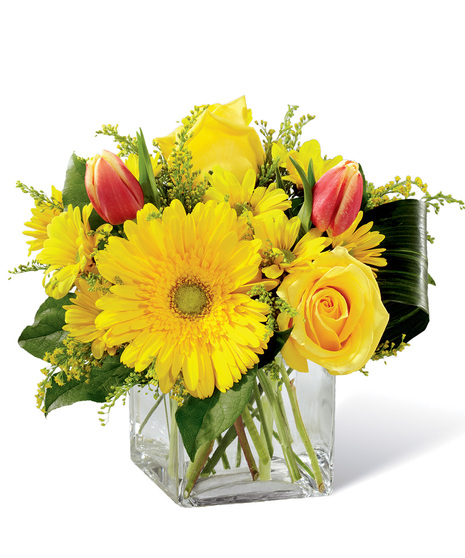 Spring flowers in a cube vase