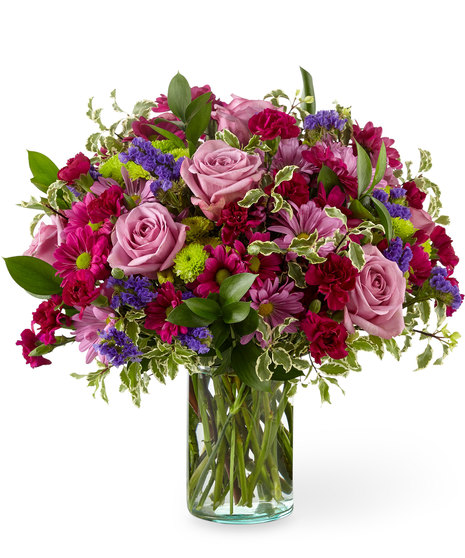 Lovely pink and mauve flowers in a cylinder vase