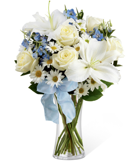 White and blue flowers in a glass vase