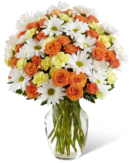 Daisies, spray roses and mini carnations in a vase