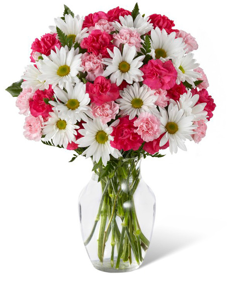 Pink and white flowers in a glass vase
