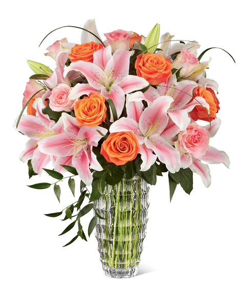 Luxury bouquet of lilies and roses in a designer vase