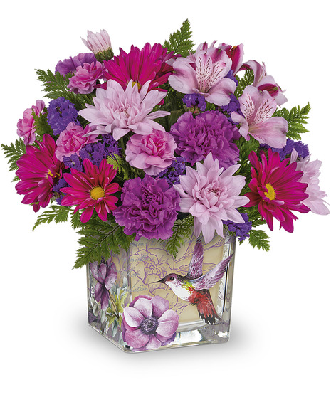 Flowers arranged in a lovely hummingbird design cube vase