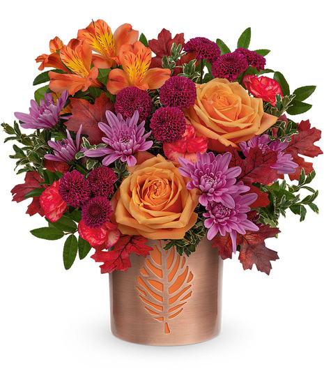 Fall flowers arranged in a re-usable copper finished cylinder