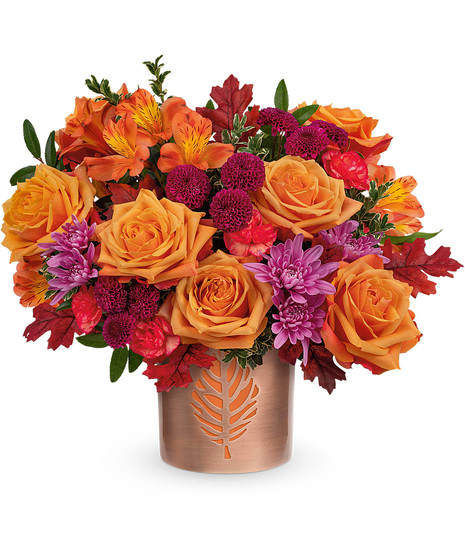Fall flowers arranged in a re-usable copper finished cylinder