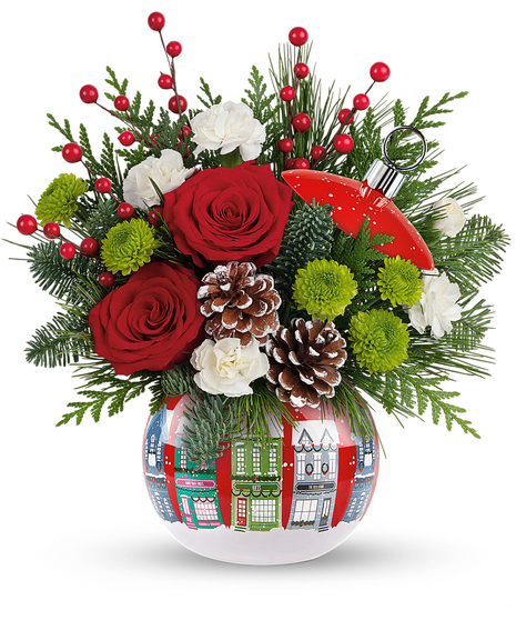 Christmas flowers arranged in a Christmas ornament vase