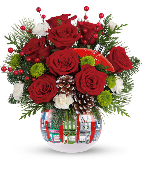 Christmas flowers arranged in a Christmas ornament vase