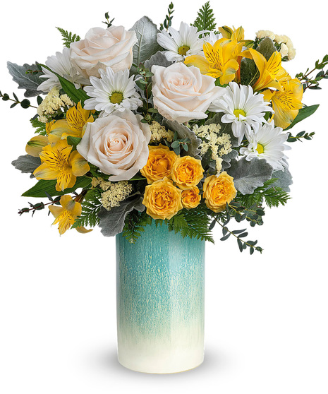 Yellow, white and crème flowers in a lovely vase