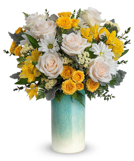 Yellow, white and crème flowers in a lovely vase