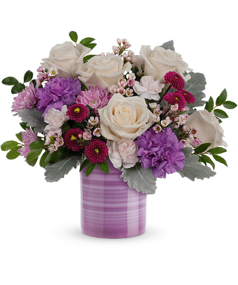 Cream, pink and purple flowers in a lavender Serene Swirl Vase