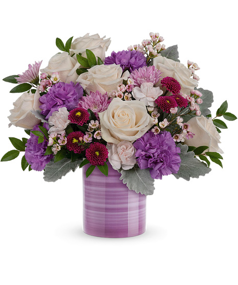 Cream, pink and purple flowers in a lavender Serene Swirl Vase