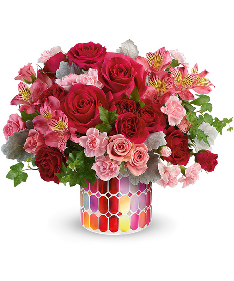 Assorted pink flowers in a Charming Mosaic cylinder