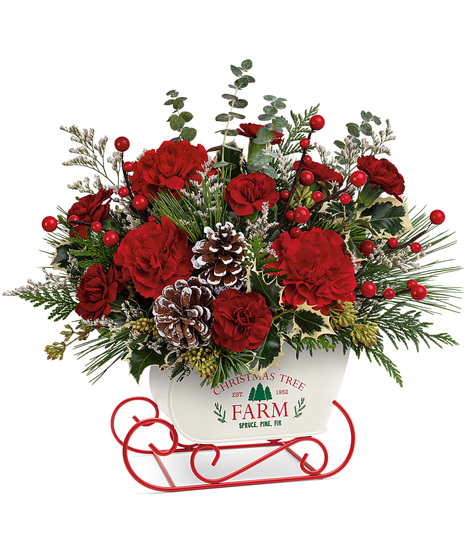 Holiday bouquet arranged in a metal sled