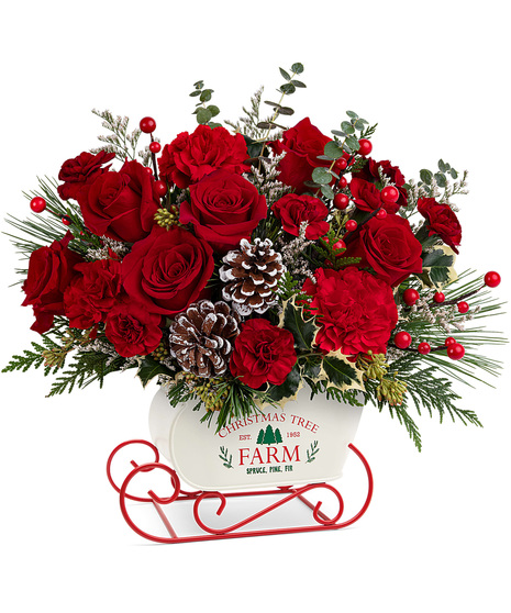 Holiday bouquet arranged in a metal sled