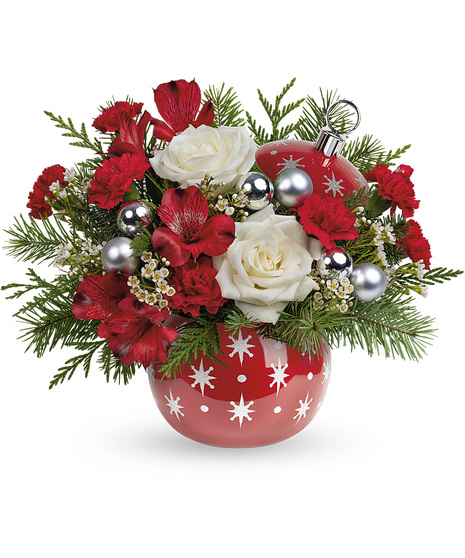 Christmas bouquet arranged in a festive ceramic ornament jar with stars