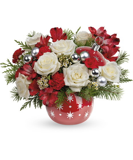 Christmas bouquet arranged in a festive ceramic ornament jar with stars