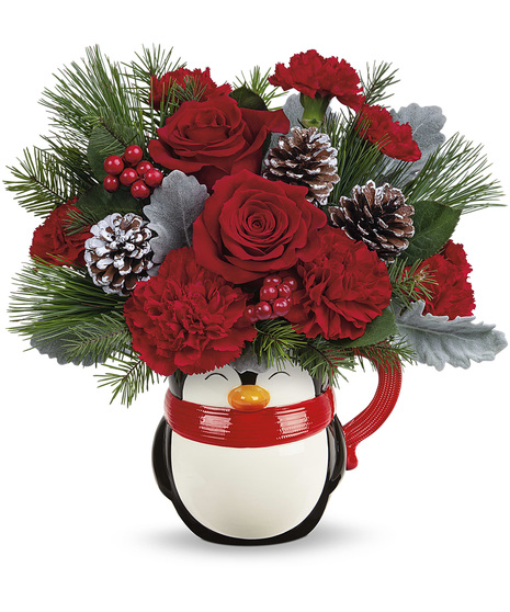 Christmas flowers in a ceramic penguin mug