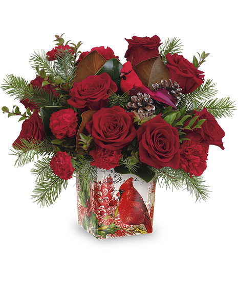 Christmas flowers arranged in a Cardinal Cheer Cube