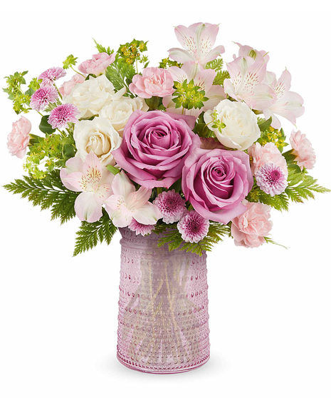 Beautiful Mother's Day arrangement in pink glass carafe.