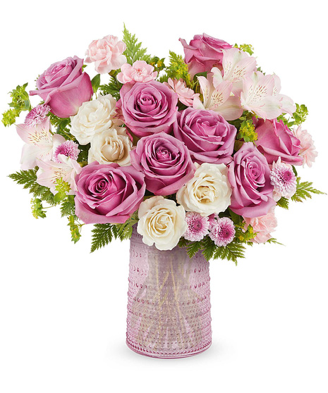Beautiful Mother's Day arrangement in pink glass carafe.