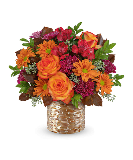Radiant Mosaic Bouquet with peach roses, alstroemeria, carnations, chrysanthemums, and autumn foliage in a golden mosaic vase.