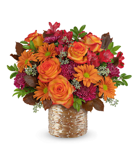 Radiant Mosaic Bouquet with peach roses, alstroemeria, carnations, chrysanthemums, and autumn foliage in a golden mosaic vase.