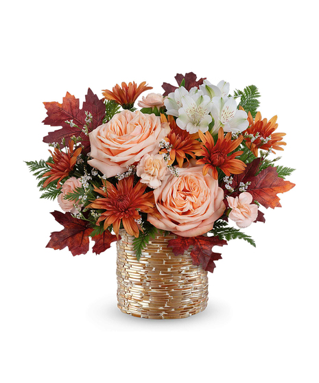 Sparkling Blooms Bouquet with orange roses, red alstroemeria, chrysanthemums, and autumn accents in a copper vase.