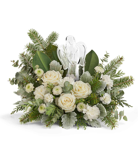 Light of Love Bouquet with white roses, carnations, button chrysanthemums, and winter greens surrounding a keepsake crystal angel.