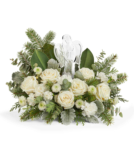 Light of Love Bouquet with white roses, carnations, button chrysanthemums, and winter greens surrounding a keepsake crystal angel.