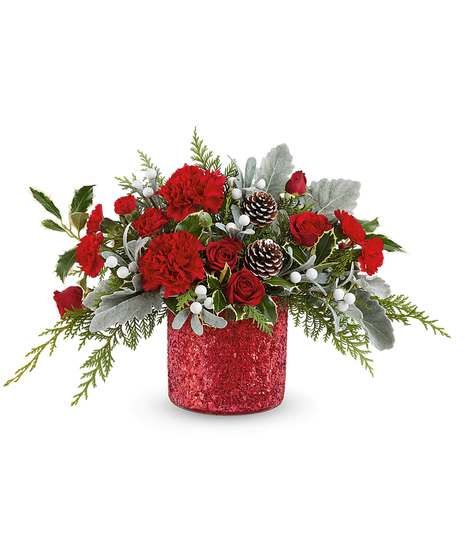 Magical Wish Bouquet with red spray roses, carnations, dusty miller, cedar, and holly in a glittering holiday vase.