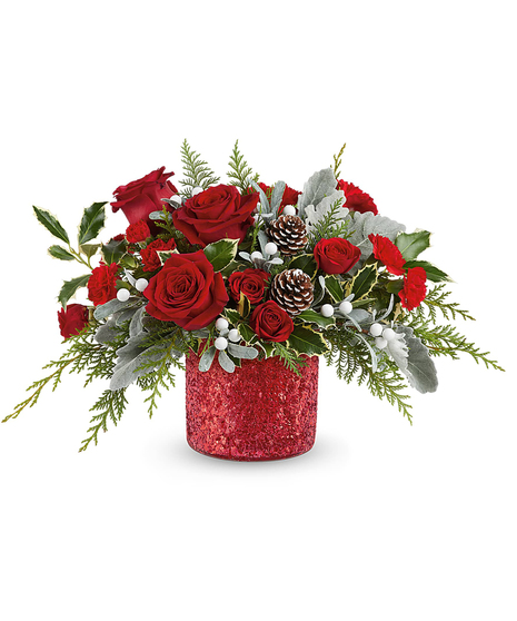 Magical Wish Bouquet with red spray roses, carnations, dusty miller, cedar, and holly in a glittering holiday vase.