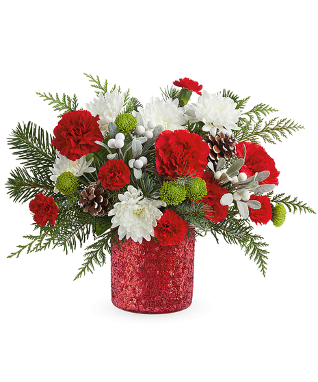 Christmas Magic Bouquet with red carnations, green button chrysanthemums, white cushion mums, evergreens, and pinecones in a glittering holiday vase.