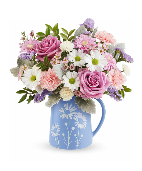 Pastel Meadow Bouquet with lavender roses and pastel flowers arranged in a blue pitcher with white daisy design