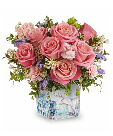 Whisper of Grace Bouquet with pink roses and pastel flowers arranged in a decorative glass cube with dove design