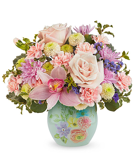 pretty in pastels bouquet with pink, peach and lavender flowers in a decorative floral glass vase