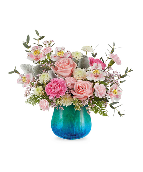 Blush pink and white spring flower arrangement in turquoise crackled glass vase