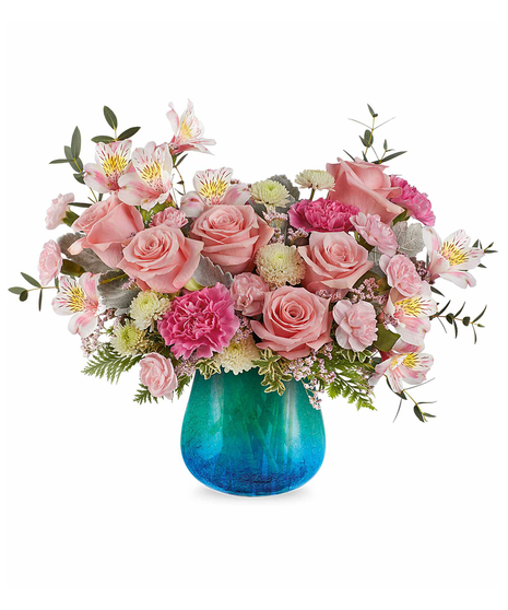 Blush pink and white spring flower arrangement in turquoise crackled glass vase