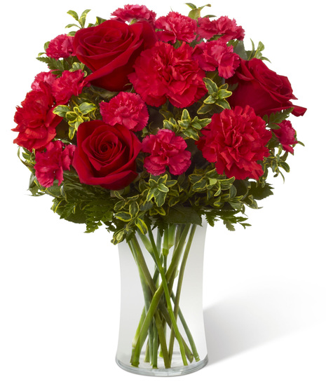 Vase of roses and carnations in red and fuchsia