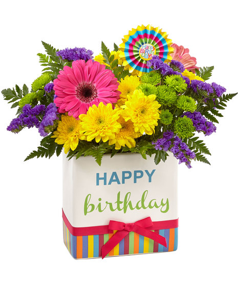 Colourful flowers in birthday themed vase