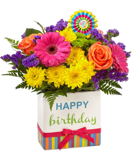 Colourful flowers in birthday themed vase