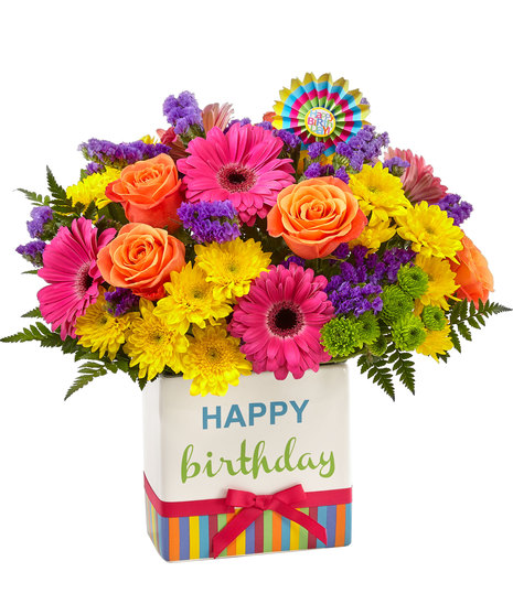 Colourful flowers in birthday themed vase