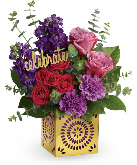 Bold flowers with a celebrate pic in a metallic cut out vase