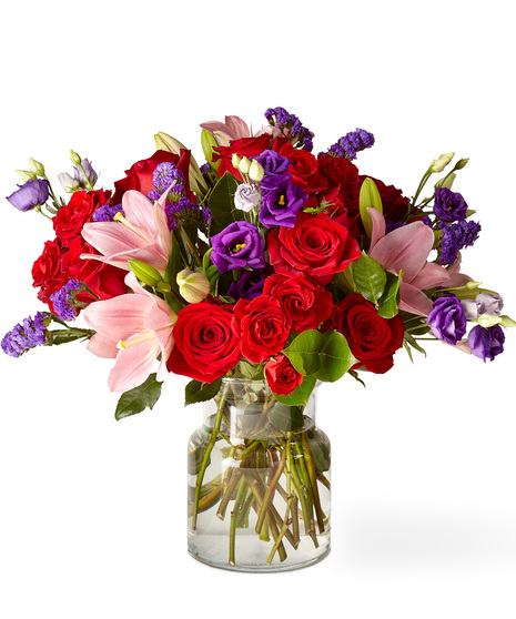 Pink, red and purple flowers in a glass vase